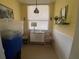 Small dining area with table and chairs, plus window at 300 Woodette Dr # 203, Dunedin, FL 34698