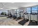 Bright gym with treadmills, ellipticals and stationary bikes at 300 Woodette Dr # 203, Dunedin, FL 34698