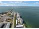 Aerial view showcasing waterfront location and building at 300 Woodette Dr # 203, Dunedin, FL 34698