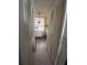 Clean hallway with access to multiple rooms and closets at 300 Woodette Dr # 203, Dunedin, FL 34698