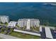 Condo building and parking with waterfront view at 300 Woodette Dr # 203, Dunedin, FL 34698