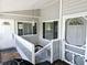 Front entry with stairs leading down to lower level at 131 E Bay Dr, Treasure Island, FL 33706