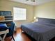 Main bedroom with king-size bed and en-suite bath at 131 E Bay Dr, Treasure Island, FL 33706