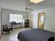 Comfortable bedroom with a queen bed and plenty of natural light at 131 E Bay Dr, Treasure Island, FL 33706