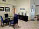Bright dining room with glass table and four chairs at 131 E Bay Dr, Treasure Island, FL 33706