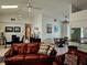 Spacious living area with leather furniture and a view into the dining area at 131 E Bay Dr, Treasure Island, FL 33706