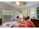 Cozy living room with view into bedroom and patio access at 6428 Gloria Dr # 15, New Port Richey, FL 34653
