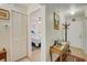 Bright entryway with coat rack and view of bedroom at 6428 Gloria Dr # 15, New Port Richey, FL 34653