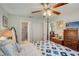 Main bedroom with a post bed, dresser, and ensuite bathroom at 6428 Gloria Dr # 15, New Port Richey, FL 34653