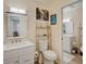 Bathroom with double vanity and access to another bathroom at 6428 Gloria Dr # 15, New Port Richey, FL 34653