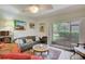 Relaxing living room with a sofa, armchairs, and access to patio at 6428 Gloria Dr # 15, New Port Richey, FL 34653