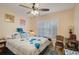 Bedroom with queen bed, ceiling fan and window shutters at 6428 Gloria Dr # 15, New Port Richey, FL 34653