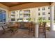 Outdoor grilling area with tables and chairs for dining at 11 San Marco St # 903, Clearwater, FL 33767