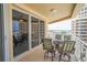 Spacious balcony with patio furniture and city views at 11 San Marco St # 903, Clearwater, FL 33767