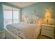 Charming bedroom with coastal decor and ocean views at 11 San Marco St # 903, Clearwater, FL 33767
