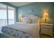 Charming bedroom with coastal decor and ocean views at 11 San Marco St # 903, Clearwater, FL 33767