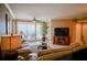 Living room boasts ocean views, leather sofas, and access to a balcony at 11 San Marco St # 903, Clearwater, FL 33767