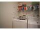 Convenient laundry room with washer, dryer, and storage shelves at 11 San Marco St # 903, Clearwater, FL 33767