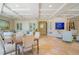 Spacious common area with seating, a large aquarium, and dining table at 11 San Marco St # 903, Clearwater, FL 33767