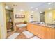 Elegant bathroom with marble finishes, double vanity, and soaking tub at 11 San Marco St # 903, Clearwater, FL 33767