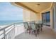 Ocean view balcony with table and chairs, perfect for relaxing and enjoying the scenery at 11 San Marco St # 903, Clearwater, FL 33767