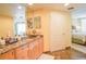 Modern bathroom with marble vanity and a view of the bedroom at 11 San Marco St # 903, Clearwater, FL 33767