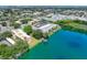 Aerial view of condo community near the waterfront with lush vegetation at 11485 Oakhurst Rd # 107, Largo, FL 33774