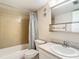Clean bathroom with tub, toilet, and vanity at 11485 Oakhurst Rd # 107, Largo, FL 33774