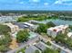 Community features pool, parking and lake at 11485 Oakhurst Rd # 107, Largo, FL 33774