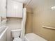 Bathroom with tub, toilet and storage cabinet at 11485 Oakhurst Rd # 107, Largo, FL 33774