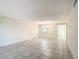 Bright dining room with tile floors and chandelier at 11485 Oakhurst Rd # 107, Largo, FL 33774