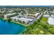 Aerial view of waterfront community with lush landscaping and parking at 11485 Oakhurst Rd # 107, Largo, FL 33774