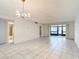 Spacious dining area with tile floors and view of bathroom at 11485 Oakhurst Rd # 107, Largo, FL 33774