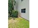 Landscaped area with lush green grass and bushes at 11485 Oakhurst Rd # 107, Largo, FL 33774