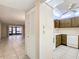 View of kitchen with wood cabinets, white appliances, and tiled flooring at 11485 Oakhurst Rd # 107, Largo, FL 33774