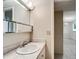 Bathroom with sink and vanity, view of dining room at 11485 Oakhurst Rd # 107, Largo, FL 33774