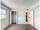 Bedroom with double door closet and access to hallway at 11485 Oakhurst Rd # 107, Largo, FL 33774