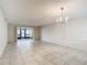 Dining room with tile floors and chandelier at 11485 Oakhurst Rd # 107, Largo, FL 33774