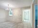 Dining room with tile floors and access to hallway at 11485 Oakhurst Rd # 107, Largo, FL 33774