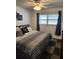 Bedroom featuring a comfortable bed, natural light, and neutral decor with a ceiling fan at 5347 81St N Ln # 22, St Petersburg, FL 33709