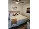 Comfortable bedroom featuring a bed with a padded headboard, soft lighting, and warm decor at 5347 81St N Ln # 22, St Petersburg, FL 33709