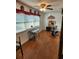 Versatile bonus room with abundant natural light, wood-look floors, and space for a desk and exercise equipment at 5347 81St N Ln # 22, St Petersburg, FL 33709