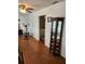 Bonus room with an exercise machine, a ceiling fan, and an open doorway to the Primary bedroom at 5347 81St N Ln # 22, St Petersburg, FL 33709
