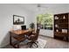 Home office with a large desk, bookcase, and window at 10590 Windsor Lake Ct # 0, Tampa, FL 33626