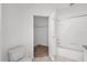 Clean bathroom with bathtub, toilet and walk-in closet at 10590 Windsor Lake Ct # 0, Tampa, FL 33626