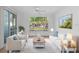 Living Room with light beige sofas and large window at 10590 Windsor Lake Ct # 0, Tampa, FL 33626