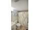 Clean bathroom with shower/tub combo and updated flooring at 948 Virginia St # 205, Dunedin, FL 34698