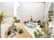 Community patio with stone table, benches, and lush landscaping at 948 Virginia St # 205, Dunedin, FL 34698