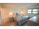 Bedroom with queen bed and neutral decor at 948 Virginia St # 205, Dunedin, FL 34698