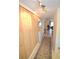 Light and bright entryway with wood-paneled walls and a runner rug at 948 Virginia St # 205, Dunedin, FL 34698